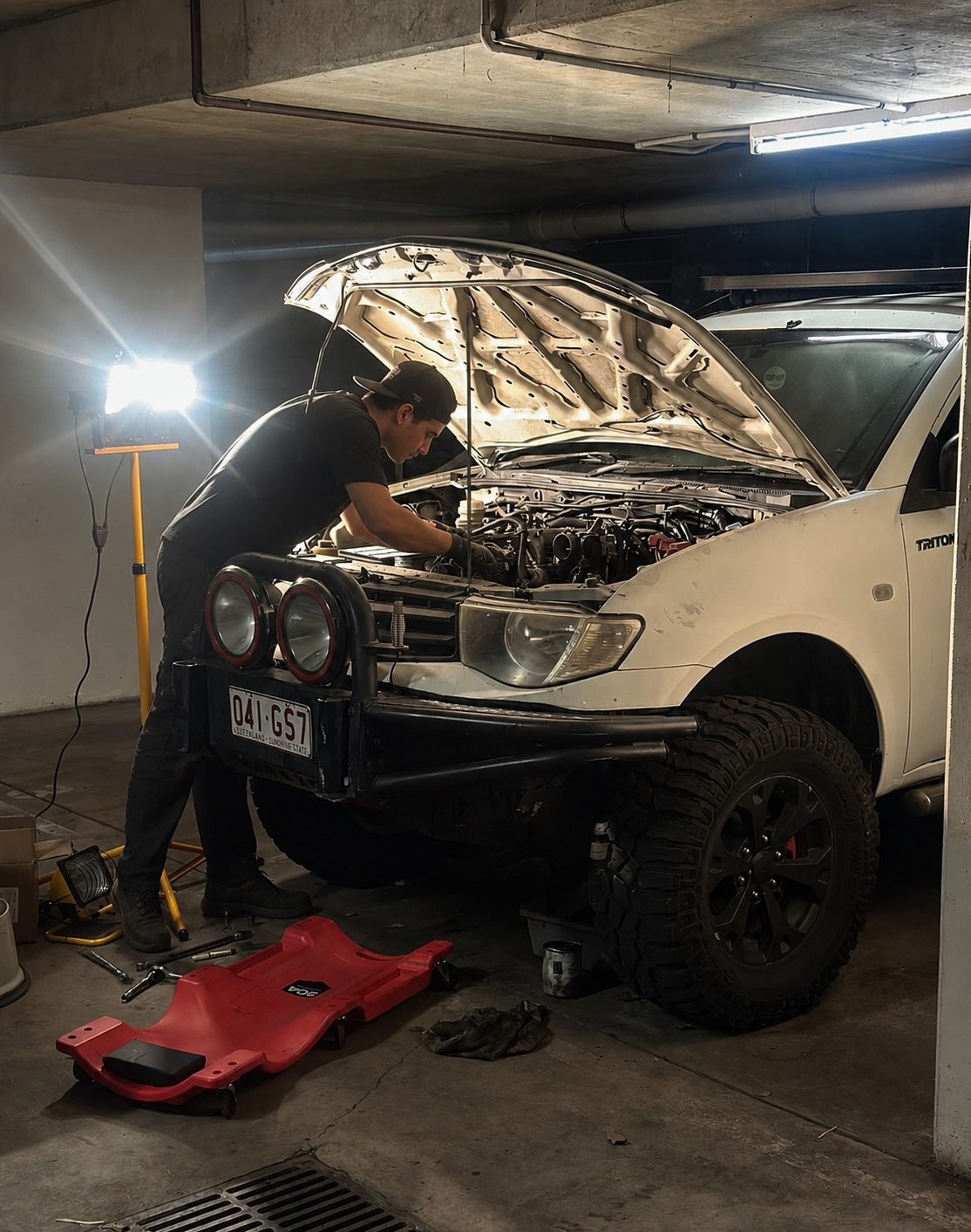 Blue vehicle engine bay opened for servicing
